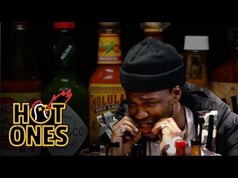 Curren$y Talks Munchies, Industry Games, and Rap Dogs While Eating Spicy Wings