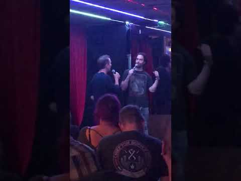 Chris D’Elia and Bryan Callen roasting each other on stage.